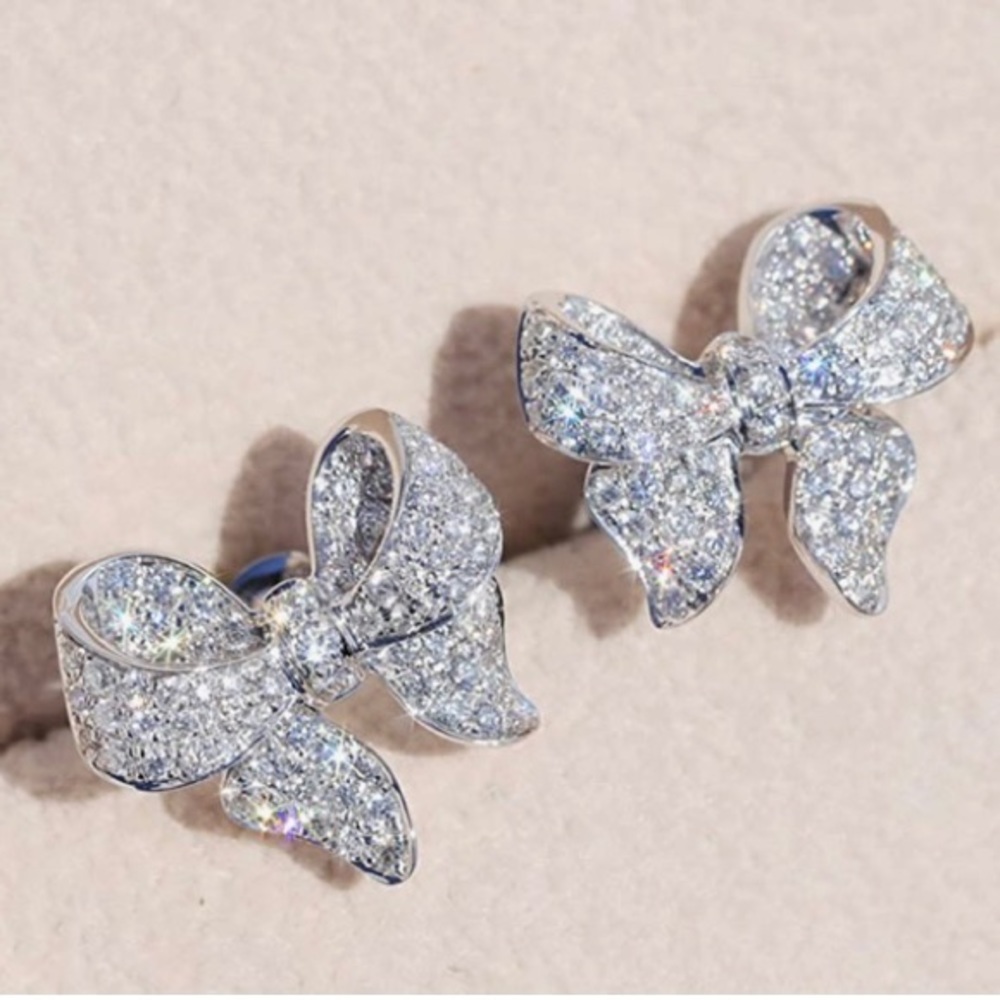 Sterling silver and CZ bow earrings.